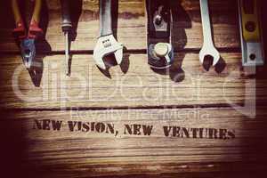 New vision, new  ventures against desk with tools