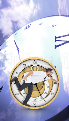 Composite image of geeky young businessman running late