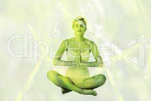 Composite image of fit woman doing yoga
