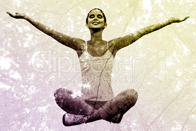 Composite image of woman sitting with arms raised