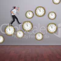 Composite image of geeky businessman running late