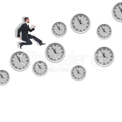 Composite image of geeky young businessman running mid air