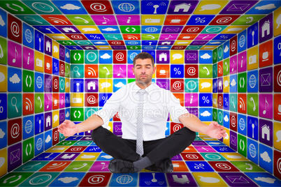 Composite image of businessman meditating in lotus pose