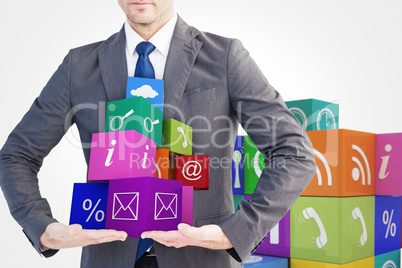 Composite image of businessman presenting your product with hand