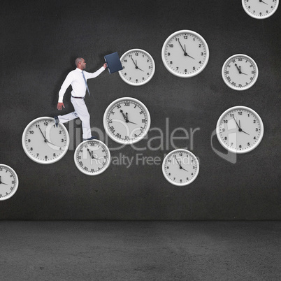 Composite image of businessman running with briefcase