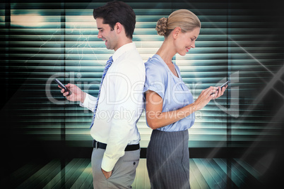 Composite image of business people using smartphone back to back