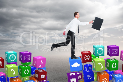 Composite image of businessman walking with his briefcase