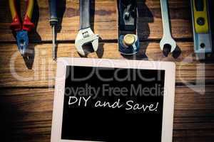 Diy and save! against desk with tools