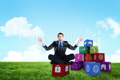 Composite image of calm businessman sitting in lotus pose