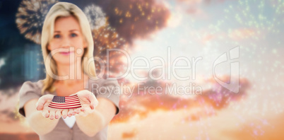 Composite image of happy blonde holding hands out