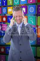 Composite image of businessman with headache