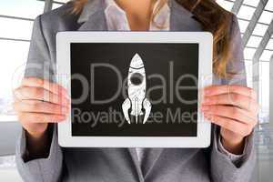 Composite image of businesswoman showing tablet