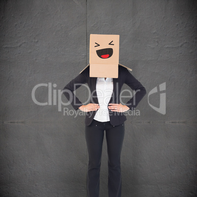 Composite image of businesswoman with box over head