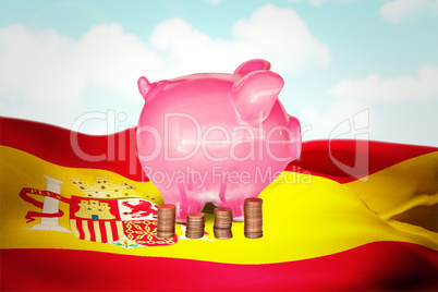 Composite image of coins and piggy bank