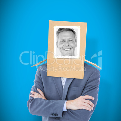 Composite image of businessman with photo box on head