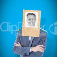 Composite image of businessman with photo box on head