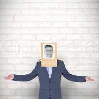 Composite image of businessman with photo box on head