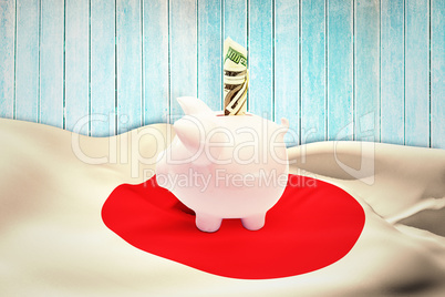 Composite image of dollar in piggy bank