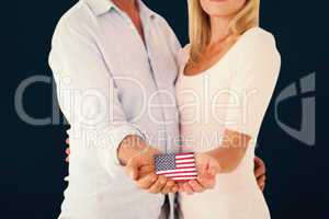 Composite image of happy couple holding their hands out