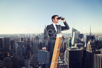 Composite image of businessman looking on a ladder