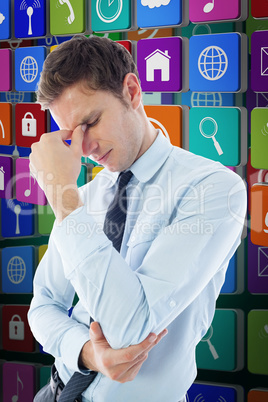 Composite image of businessman with a headache