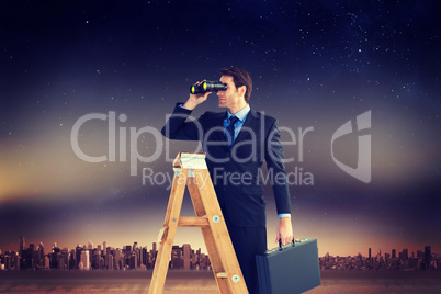 Composite image of businessman looking on a ladder