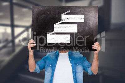 Composite image of casual man showing board