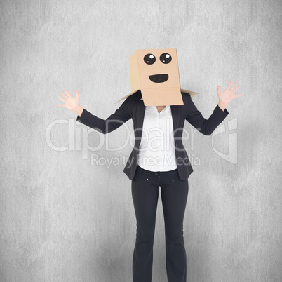 Composite image of businesswoman with box over head