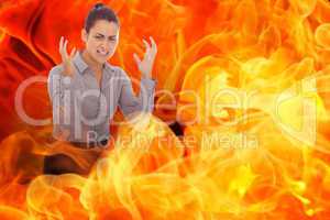 Composite image of frustrated businesswoman shouting