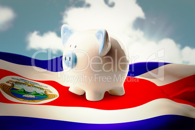 Composite image of piggy bank