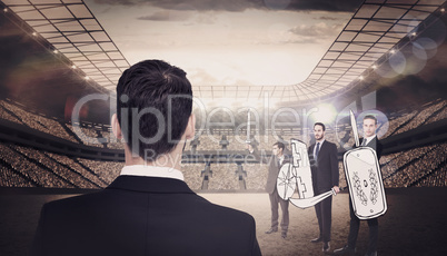 Composite image of rear view of businessman in suit standing
