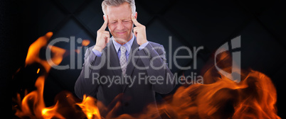Composite image of businessman with headache