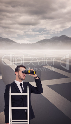 Composite image of businessman looking on a ladder