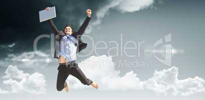 Composite image of cheering businessman