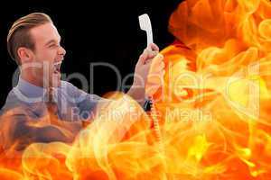 Composite image of businessman shouting at phone