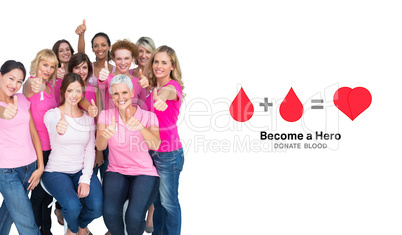 Composite image of voluntary cheerful women wearing pink for bre