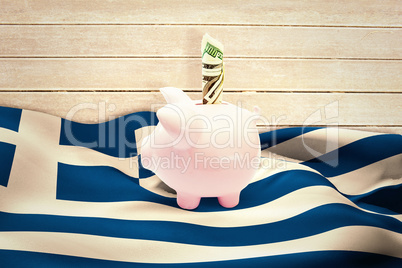 Composite image of dollar in piggy bank