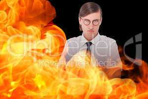 Composite image of geeky businessman looking at camera with arms