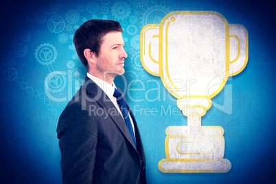 Composite image of handsome businessman looking away