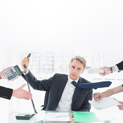Composite image of businessman in suit offering his hand