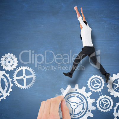 Composite image of cheering businessman