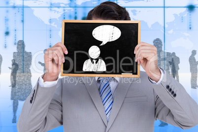 Composite image of businessman showing board