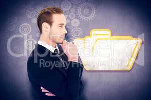 Composite image of thinking businessman standing with hand on ch