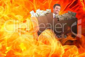 Composite image of businessman carrying bag of dollars