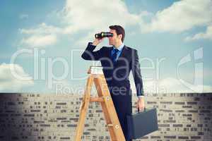 Composite image of businessman looking on a ladder