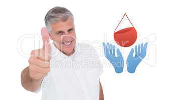 Composite image of casual man showing thumbs up at camera