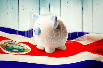 Composite image of piggy bank