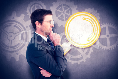 Composite image of frowning businessman thinking