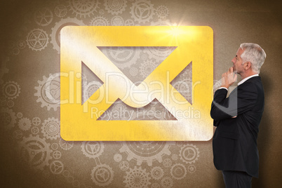 Composite image of thoughtful mature businessman posing