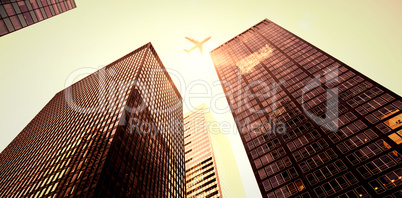 An airplane flying over buildings